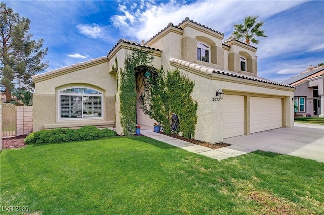 2073 Sapphire Valley Ave, Henderson, NV 89074 - mediterranean / spanish home featuring concrete driveway, stucco siding, and a front yard