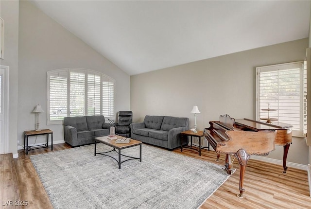 2073 Sapphire Valley Ave, Henderson, NV 89074 - living room with plenty of natural light, wood finished floors, and high vaulted ceiling
