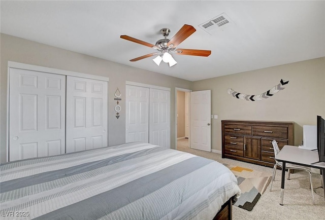 2073 Sapphire Valley Ave, Henderson, NV 89074 - bedroom with two closets, light carpet, and ceiling fan