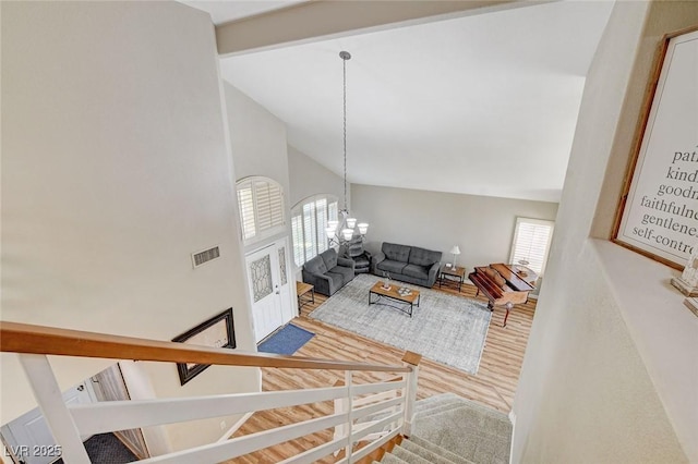 2073 Sapphire Valley Ave, Henderson, NV 89074 - living room with a chandelier, high vaulted ceiling, wood finished floors, and stairs