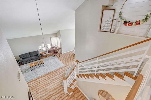 2073 Sapphire Valley Ave, Henderson, NV 89074 - stairway featuring wood finished floors and a chandelier