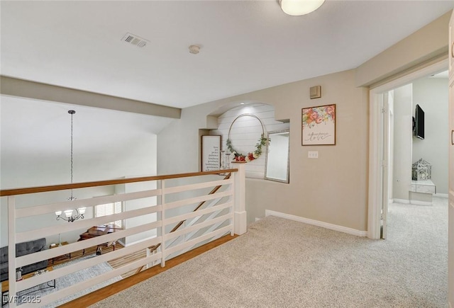 2073 Sapphire Valley Ave, Henderson, NV 89074 - hallway featuring a chandelier, carpet flooring, and an upstairs landing