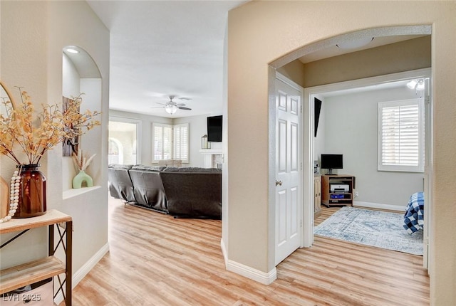 2073 Sapphire Valley Ave, Henderson, NV 89074 - hallway with light wood-style flooring and arched walkways