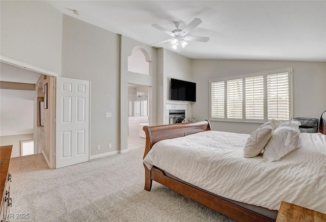 2073 Sapphire Valley Ave, Henderson, NV 89074 - carpeted bedroom featuring vaulted ceiling, a fireplace, a ceiling fan, and ensuite bath