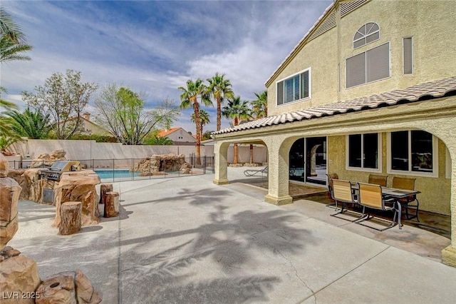2073 Sapphire Valley Ave, Henderson, NV 89074 - fenced backyard featuring a patio area, area for grilling, and outdoor dining space