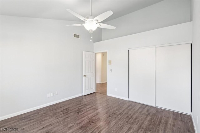 1911 Hobson Dr, Henderson, NV 89074 - unfurnished bedroom featuring a towering ceiling, wood finished floors, a closet, and a ceiling fan