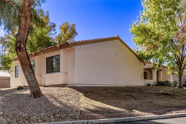 1911 Hobson Dr, Henderson, NV 89074 - view of home's exterior with stucco siding and a tile roof