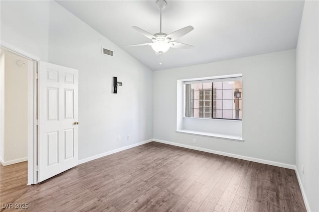 1911 Hobson Dr, Henderson, NV 89074 - unfurnished room featuring lofted ceiling, a ceiling fan, and wood finished floors