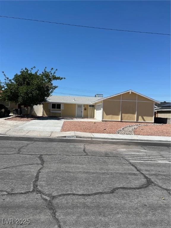 1809 Lamplighter Ln, Las Vegas, NV 89104 - view of front of property featuring an attached garage and driveway