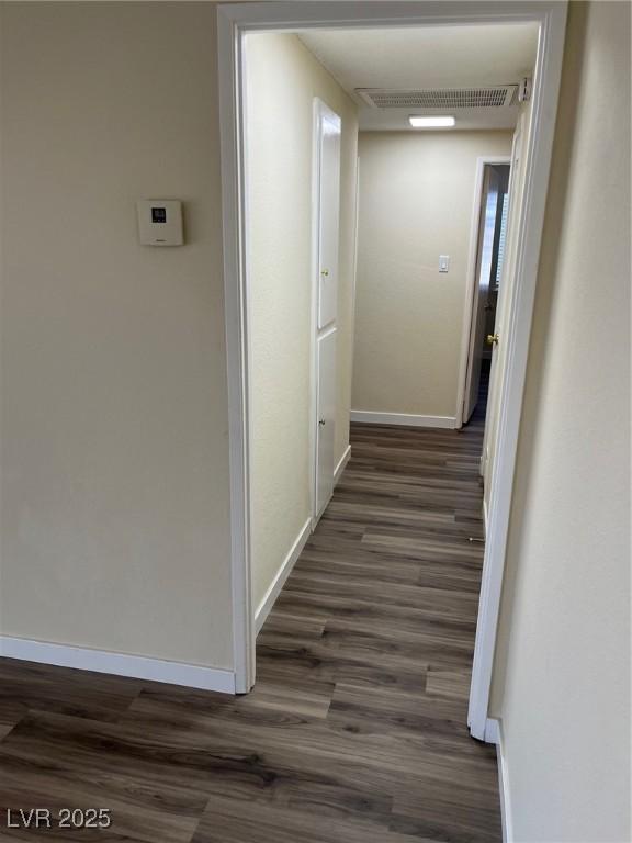 1809 Lamplighter Ln, Las Vegas, NV 89104 - hallway featuring dark wood-style floors