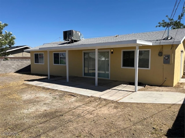 1809 Lamplighter Ln, Las Vegas, NV 89104 - rear view of house with stucco siding, a patio, and a shingled roof