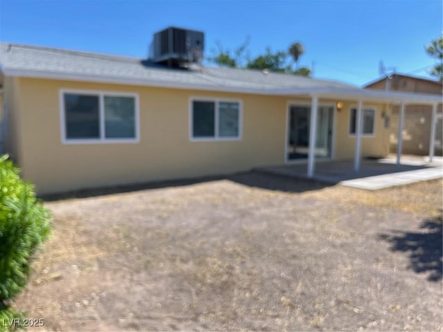 1809 Lamplighter Ln, Las Vegas, NV 89104 - back of house with stucco siding and a patio