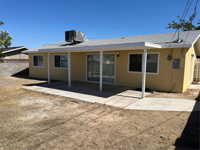 1809 Lamplighter Ln, Las Vegas, NV 89104 - rear view of house with stucco siding, a patio area, and a shingled roof