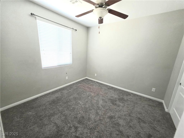 3708 Fuselier Dr, North Las Vegas, NV 89032 - empty room with dark colored carpet and a ceiling fan