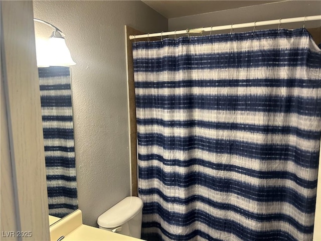 2722 Alicialynn Way, Las Vegas, NV 89121 - bathroom featuring a textured wall and a shower with shower curtain