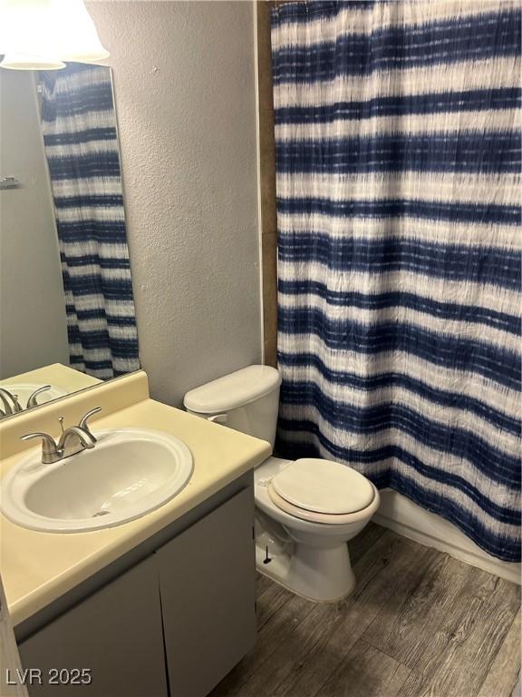 2722 Alicialynn Way, Las Vegas, NV 89121 - bathroom featuring wood finished floors, a textured wall, vanity, and a shower with curtain