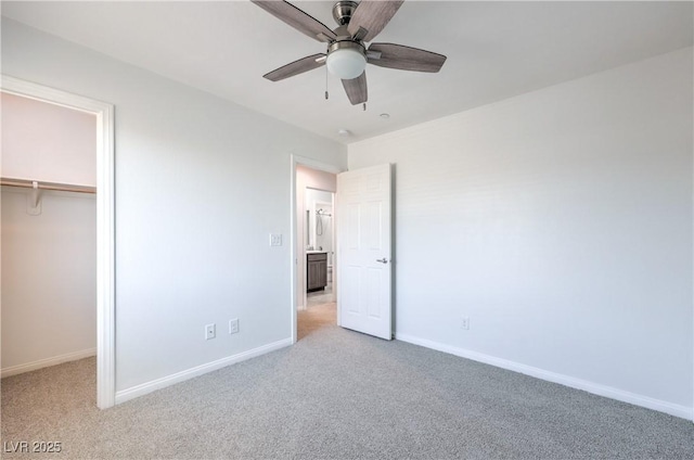 2300 Sky Island Dr, Henderson, NV 89002 - unfurnished bedroom featuring light carpet, a closet, ceiling fan, and a spacious closet