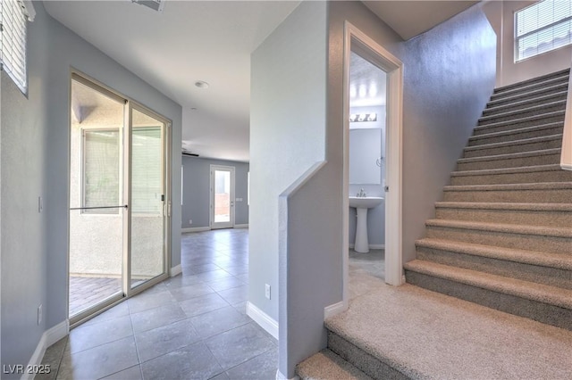 2300 Sky Island Dr, Henderson, NV 89002 - staircase featuring baseboards and tile patterned floors