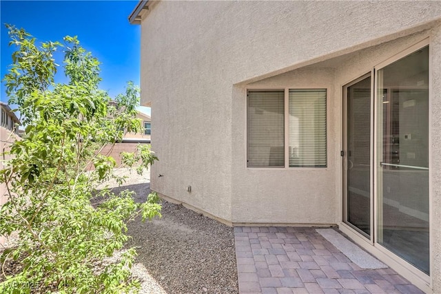 2300 Sky Island Dr, Henderson, NV 89002 - view of side of property with stucco siding and a patio area