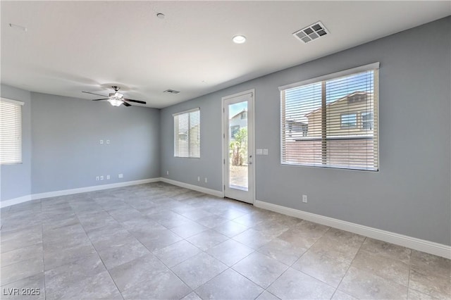 2300 Sky Island Dr, Henderson, NV 89002 - empty room featuring healthy amount of natural light, ceiling fan, light tile patterned floors, and recessed lighting