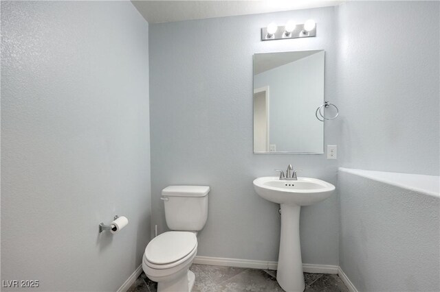 2300 Sky Island Dr, Henderson, NV 89002 - half bath featuring toilet and baseboards