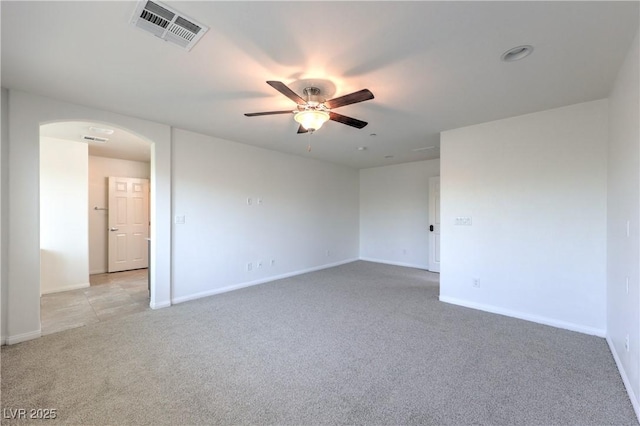 2300 Sky Island Dr, Henderson, NV 89002 - empty room featuring arched walkways, light colored carpet, and ceiling fan