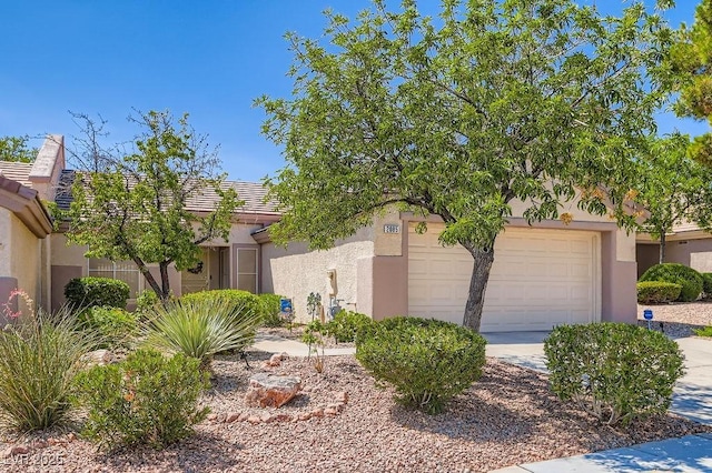 2085 Joy View Ln, Henderson, NV 89012 - obstructed view of property with a garage and stucco siding