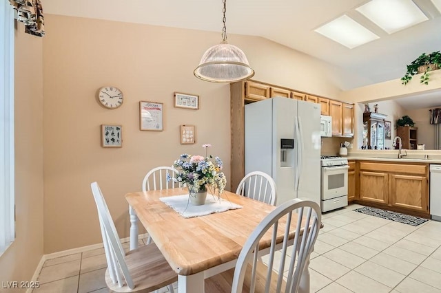 2085 Joy View Ln, Henderson, NV 89012 - dining space with light tile patterned floors and lofted ceiling