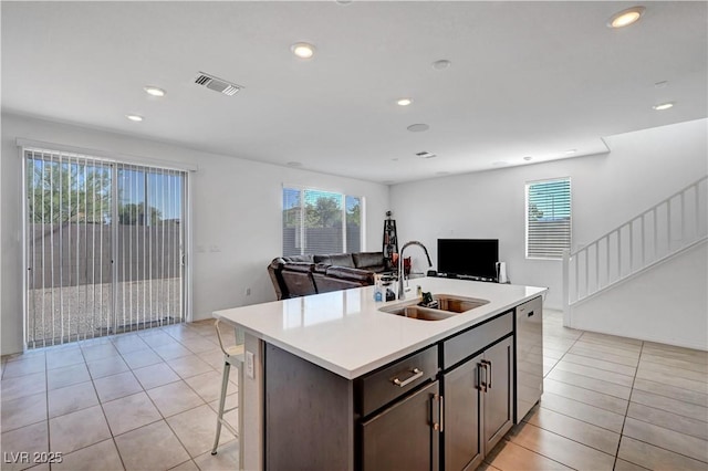 7853 Bethel Heights Ln, Las Vegas, NV 89113 - kitchen featuring open floor plan, stainless steel dishwasher, light tile patterned floors, light countertops, and recessed lighting