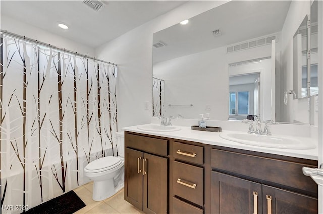 7853 Bethel Heights Ln, Las Vegas, NV 89113 - bathroom featuring double vanity, tile patterned flooring, shower / bath combo, and recessed lighting