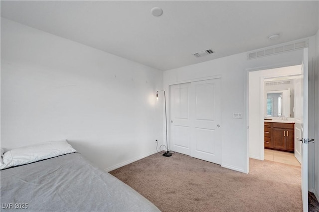 7853 Bethel Heights Ln, Las Vegas, NV 89113 - bedroom with light colored carpet and a closet