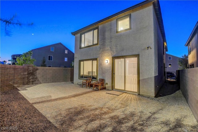 7853 Bethel Heights Ln, Las Vegas, NV 89113 - rear view of house with a patio, stucco siding, and a fenced backyard