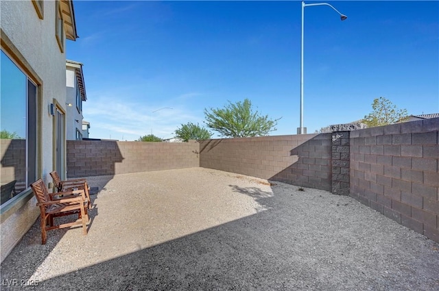 7853 Bethel Heights Ln, Las Vegas, NV 89113 - fenced backyard with a patio
