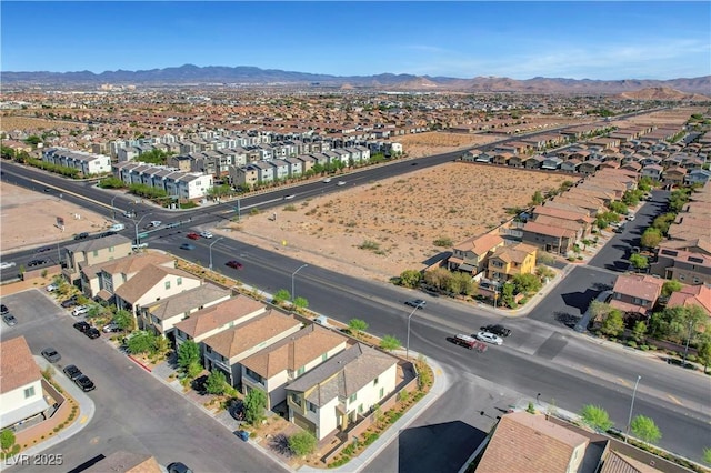 7853 Bethel Heights Ln, Las Vegas, NV 89113 - aerial overview of property's location featuring nearby suburban area and a mountain backdrop