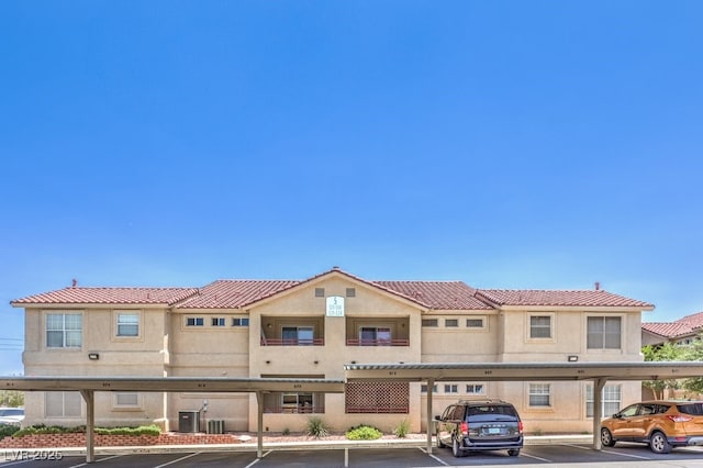 520 Arrowhead Trl Unit 522, Henderson, NV 89015 - view of front of home featuring covered parking and stucco siding