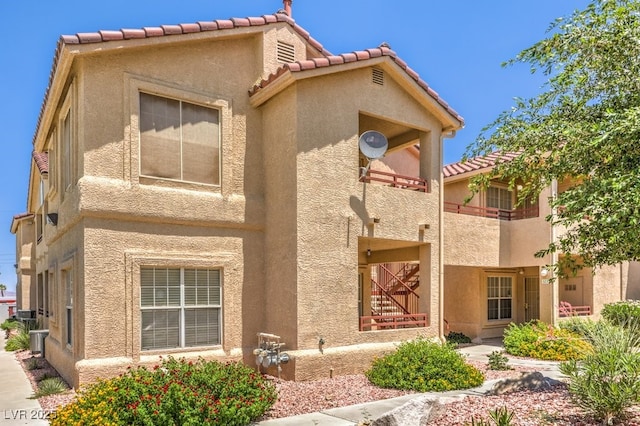 520 Arrowhead Trl Unit 522, Henderson, NV 89015 - back of property with stucco siding and a tiled roof