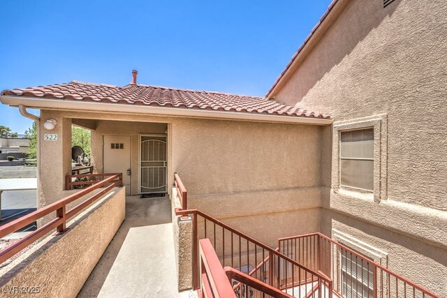 520 Arrowhead Trl Unit 522, Henderson, NV 89015 - property entrance featuring a tiled roof and stucco siding