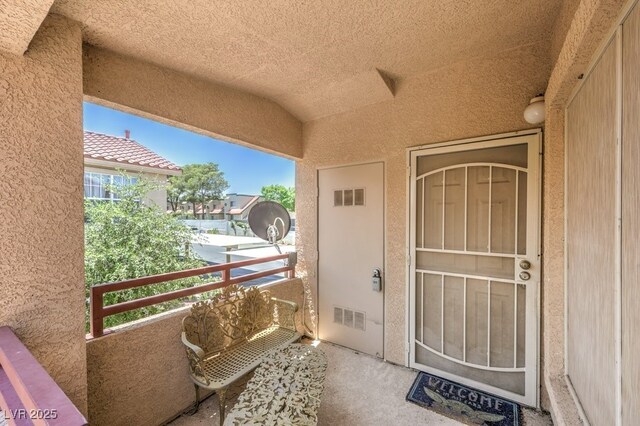520 Arrowhead Trl Unit 522, Henderson, NV 89015 - view of exterior entry featuring a balcony and stucco siding