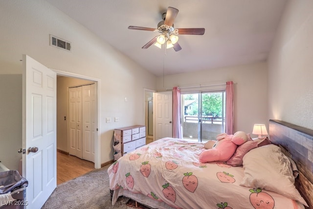 520 Arrowhead Trl Unit 522, Henderson, NV 89015 - bedroom featuring vaulted ceiling, access to outside, light carpet, a ceiling fan, and a closet