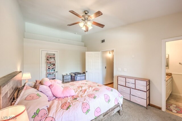 520 Arrowhead Trl Unit 522, Henderson, NV 89015 - bedroom featuring light colored carpet, ensuite bathroom, and a ceiling fan