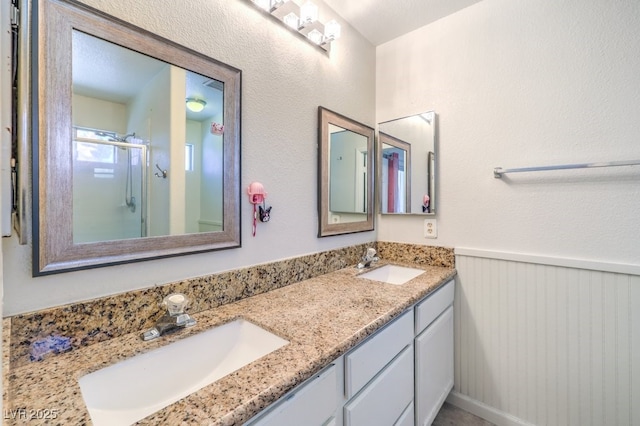 520 Arrowhead Trl Unit 522, Henderson, NV 89015 - full bath featuring double vanity, an enclosed shower, and wainscoting