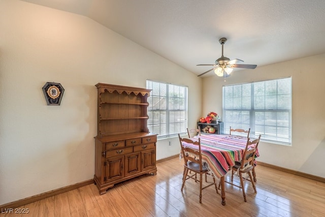 520 Arrowhead Trl Unit 522, Henderson, NV 89015 - dining room featuring vaulted ceiling, light wood-style floors, and a ceiling fan