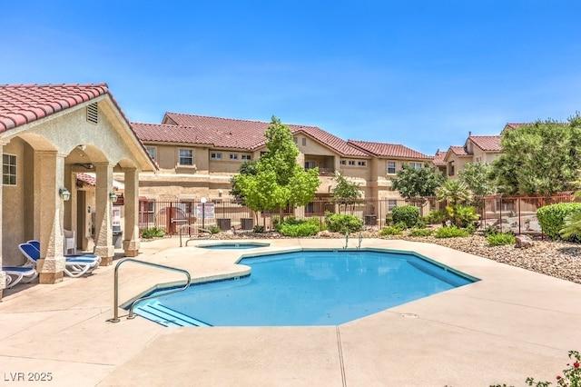 520 Arrowhead Trl Unit 522, Henderson, NV 89015 - community pool with a hot tub, a patio, and a residential view