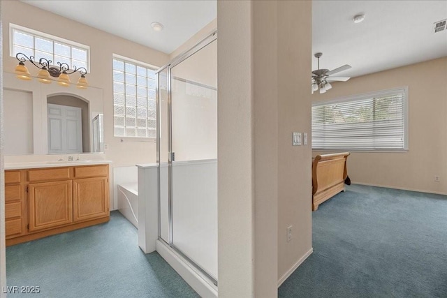 745 Diamond Bend Ave, Las Vegas, NV 89123 - full bath with a shower stall, ceiling fan, vanity, a garden tub, and carpet flooring