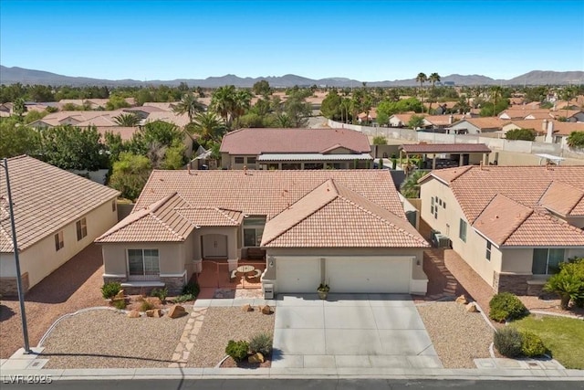 745 Diamond Bend Ave, Las Vegas, NV 89123 - view of front of house featuring a residential view, a garage, a tile roof, and stucco siding