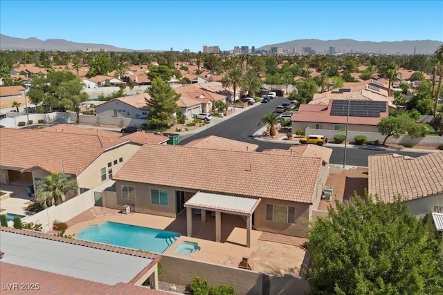 745 Diamond Bend Ave, Las Vegas, NV 89123 - view of swimming pool with a residential view, a fenced backyard, a pool with connected hot tub, a mountain view, and a patio