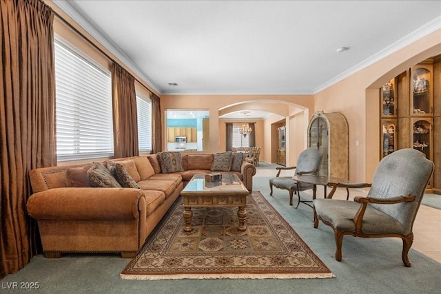745 Diamond Bend Ave, Las Vegas, NV 89123 - living area with arched walkways, carpet, crown molding, and a chandelier