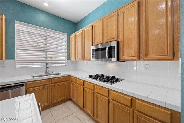 745 Diamond Bend Ave, Las Vegas, NV 89123 - kitchen with appliances with stainless steel finishes, decorative backsplash, light tile patterned floors, tile counters, and recessed lighting