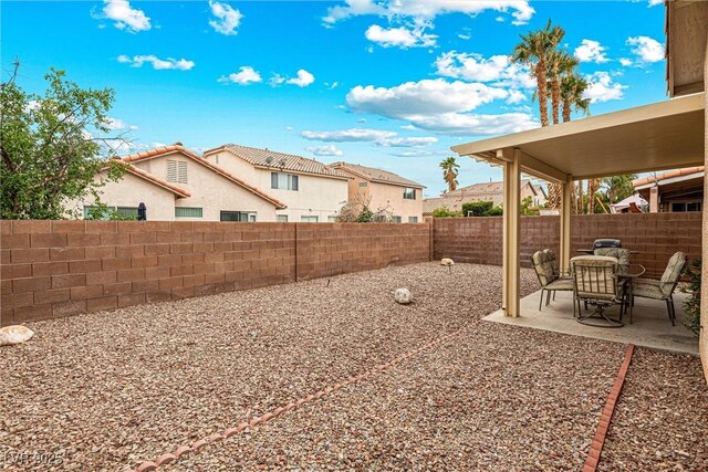 8853 Kingswood Dr, Las Vegas, NV 89147 - fenced backyard with a patio area and a residential view