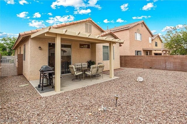 8853 Kingswood Dr, Las Vegas, NV 89147 - rear view of house with stucco siding, a fenced backyard, a patio, and a tile roof